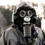 Historical Gas Mask on dark hooded man