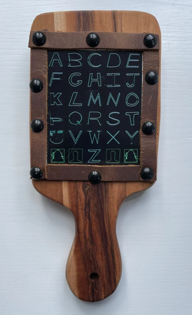 a hornbook with a digital image of oscillscope alphabet art in it
